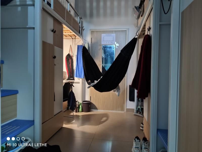 A hammock hanging in a student’s dormitory