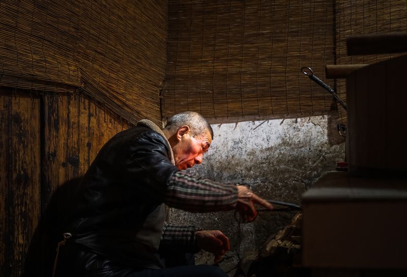 After grinding the soybeans, the tofu maker boils the soy milk