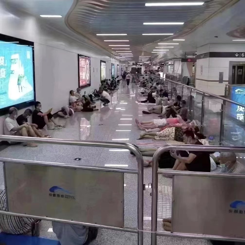 People in the subway escaping from the heat