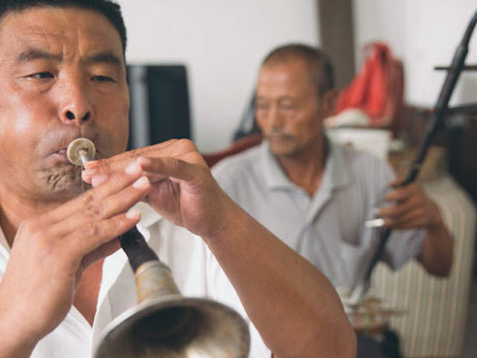 Chinese man playing the suona
