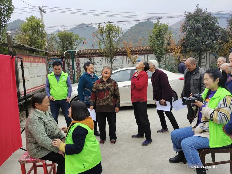 Volunteers taking photos for Chinese village elders