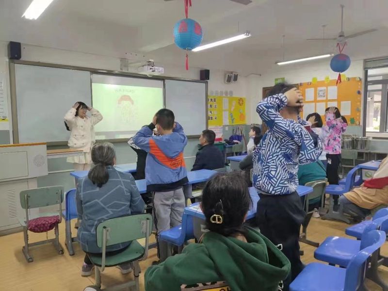 Parents and children participate together in a sex education class in China