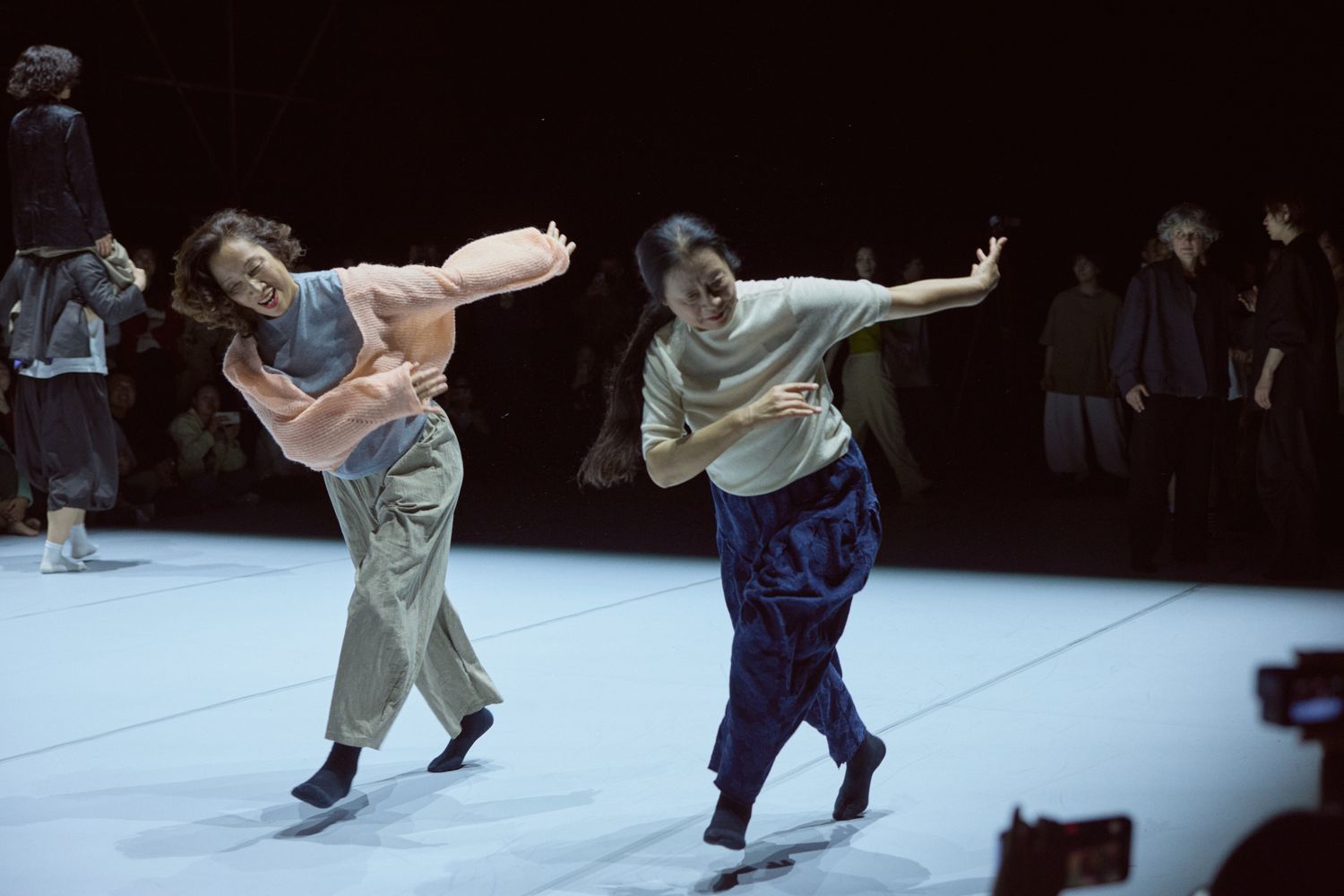 64-year-old Huang Shili (left) and a fellow performer of similar age during a duet in “Infinite Walking” at West Bund Theatre