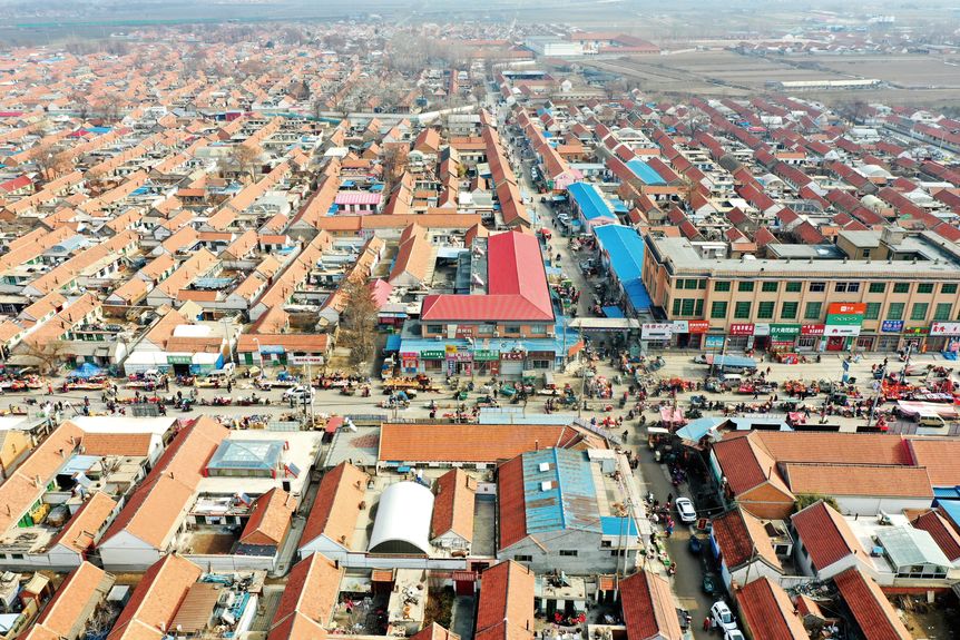 An aerial view of the street vendors and the big market in Laizhou, Shandong