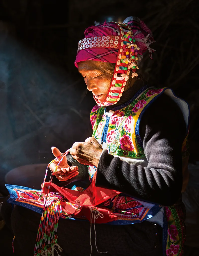 “Ancient Peoples”: A Bo woman, belonging to one of China’s oldest ethnic groups, practicing embroidery (Wenshan Autonomous Prefecture, Yunnan province, November 2018)