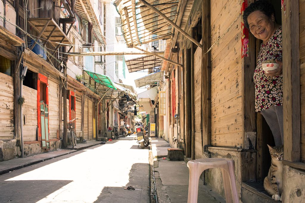 shop owner on old street in China