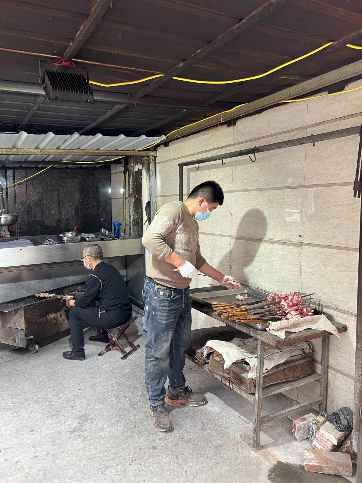 Whole roast lamb on skewers, a Caoxian delicacy