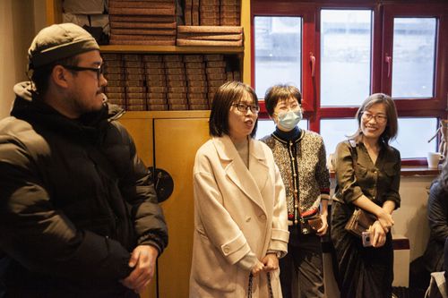 Audience members listen to another member during a TWOC event.