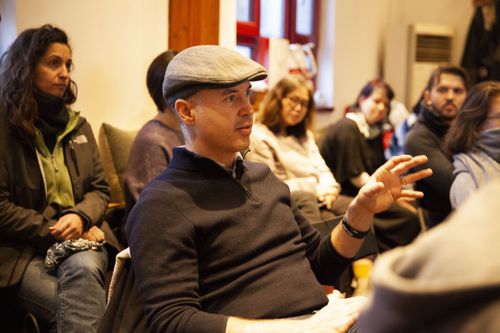 Audience member speaking during the "China Story" event.