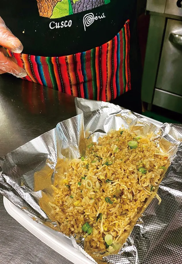 Cesar Chang offers Arroz chaufa, or fried rice, at his restaurant
