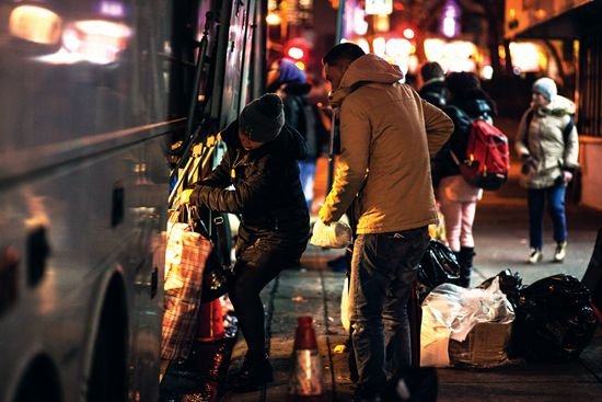 Passengers load their luggage before the 7-hour ride to Virginia aboard Tiger Bus