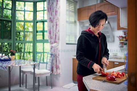 Chinese ayi cutting vegetables
