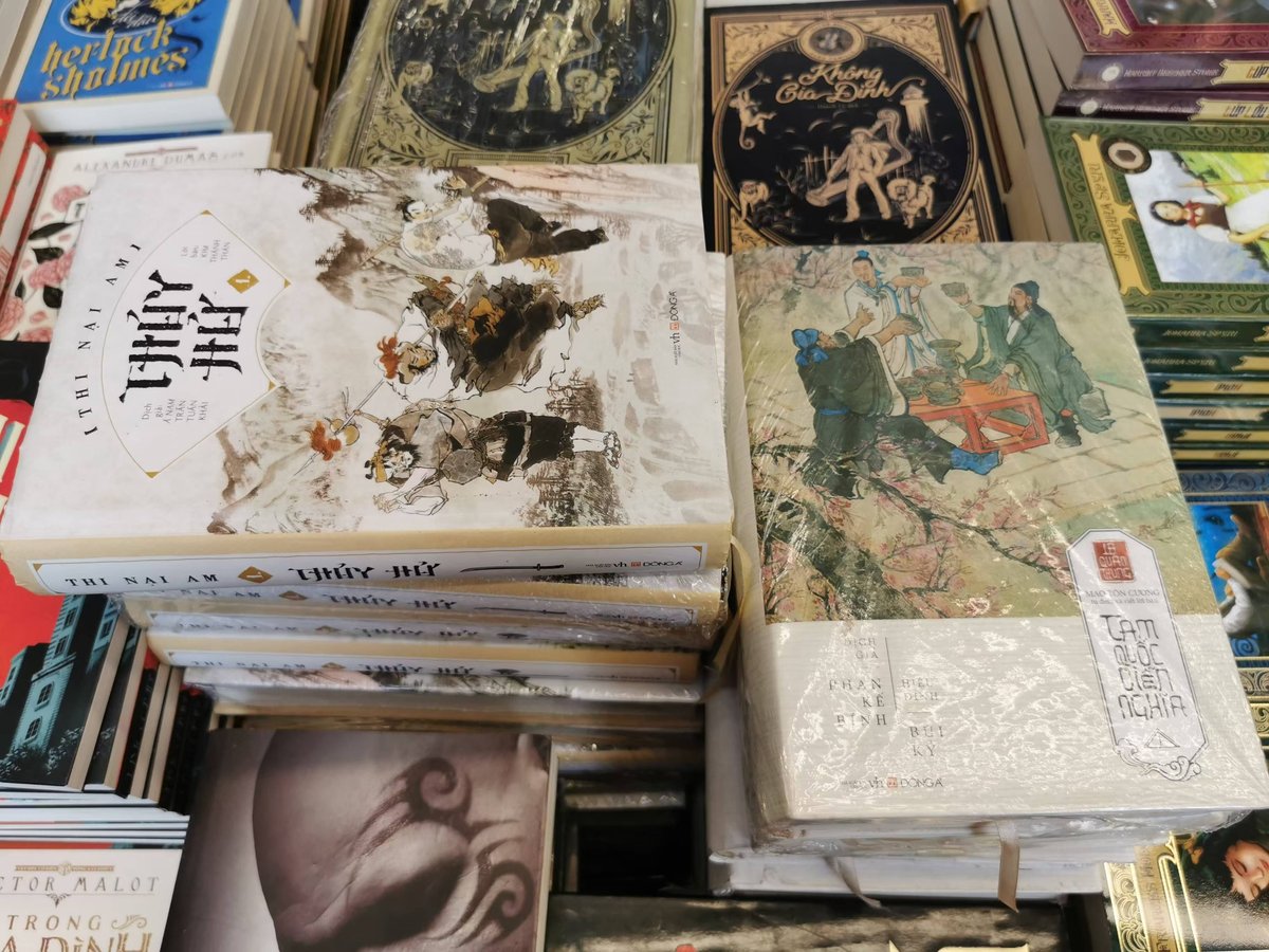 Stacks of books including Chinese classics, such as Romance of the Three Kingdoms and Outlaws of the Marsh, on display at a bookstore in Hanoi