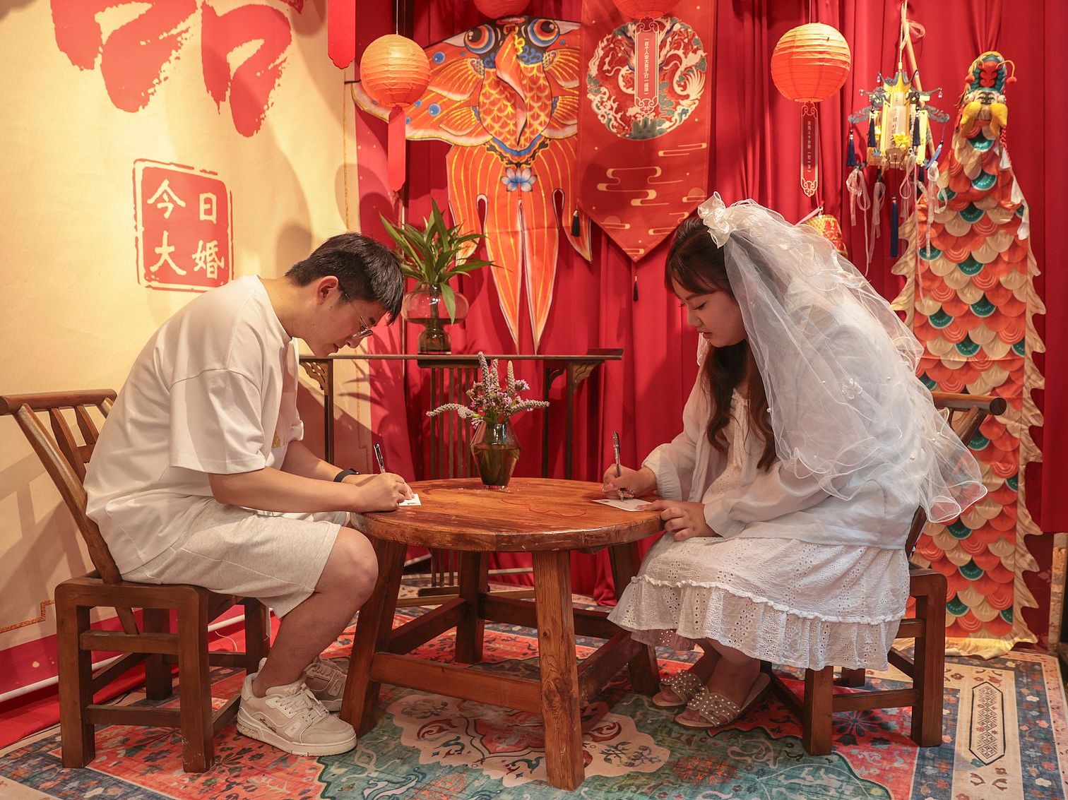 Chinese couple signing marriage license