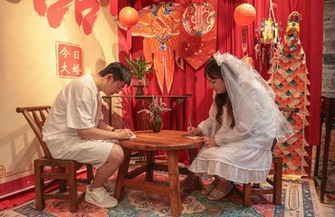 Chinese couple signing marriage license