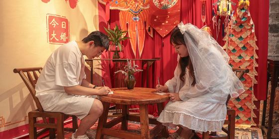 Chinese couple signing marriage license