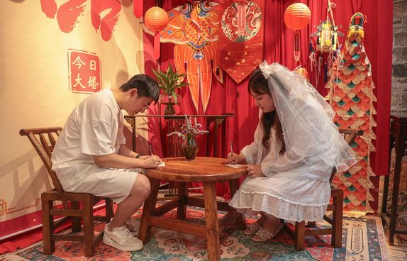 Chinese couple signing marriage license