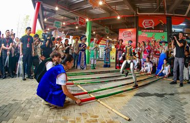Chinese ethnic minorities celebrating Sanyuesan and robots