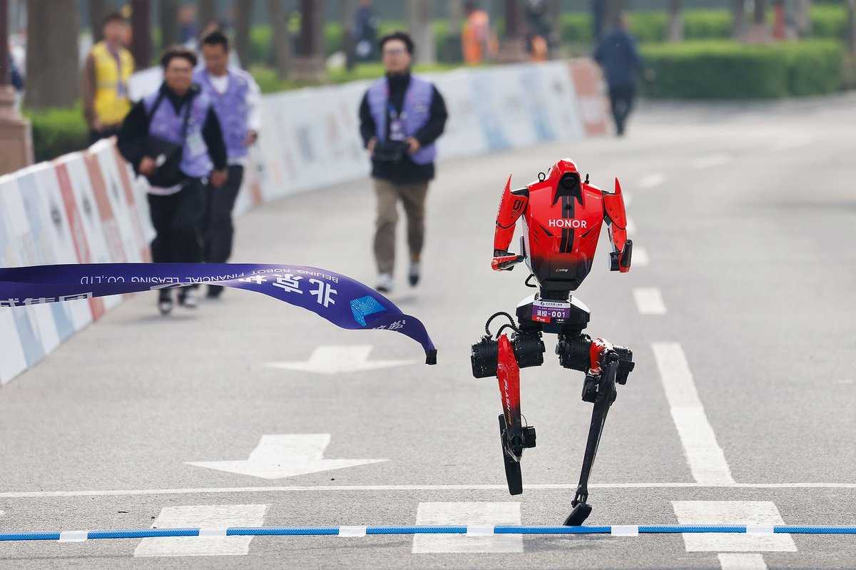 A Chinese humanoid robot from Honor sprints past the human half-marathon world record in a Beijing race