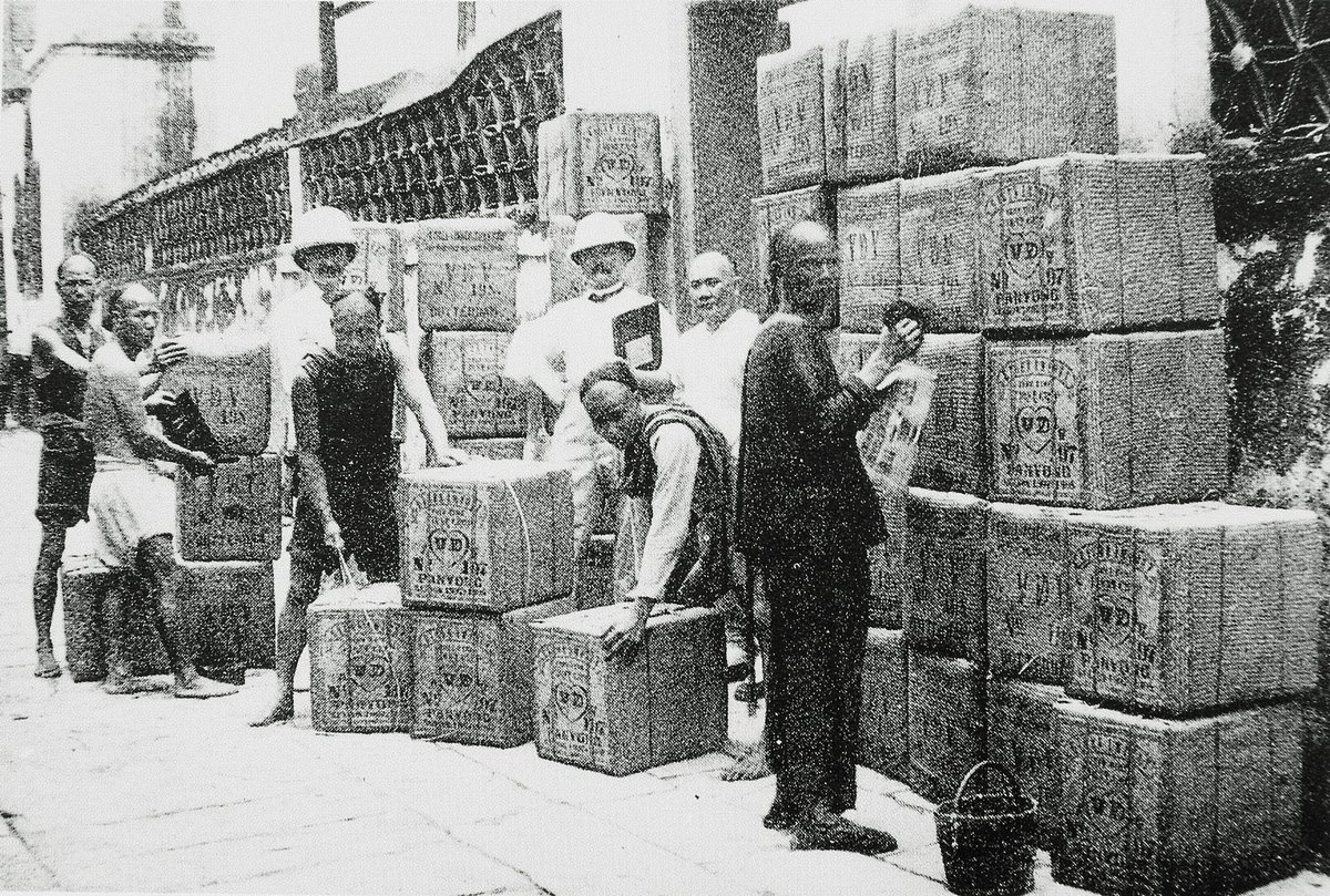 Chinese labourers moving tea awaiting export at the docks along Shanghai’s Bund in the mid-19th century