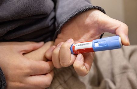 Chinese patient injecting weight-loss medication