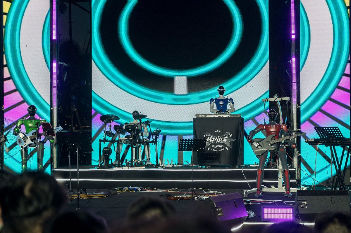 A robot band from the Chinese robotics company Casbot performed at an outdoor concert in Shenzhen during the Dragon Boat Festival in June