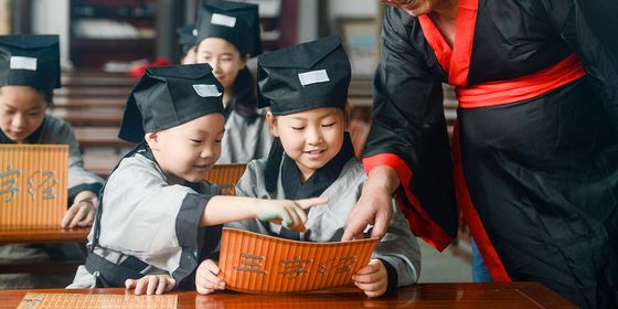 Chinese students studying Chinese with a teacher in Zhejiang