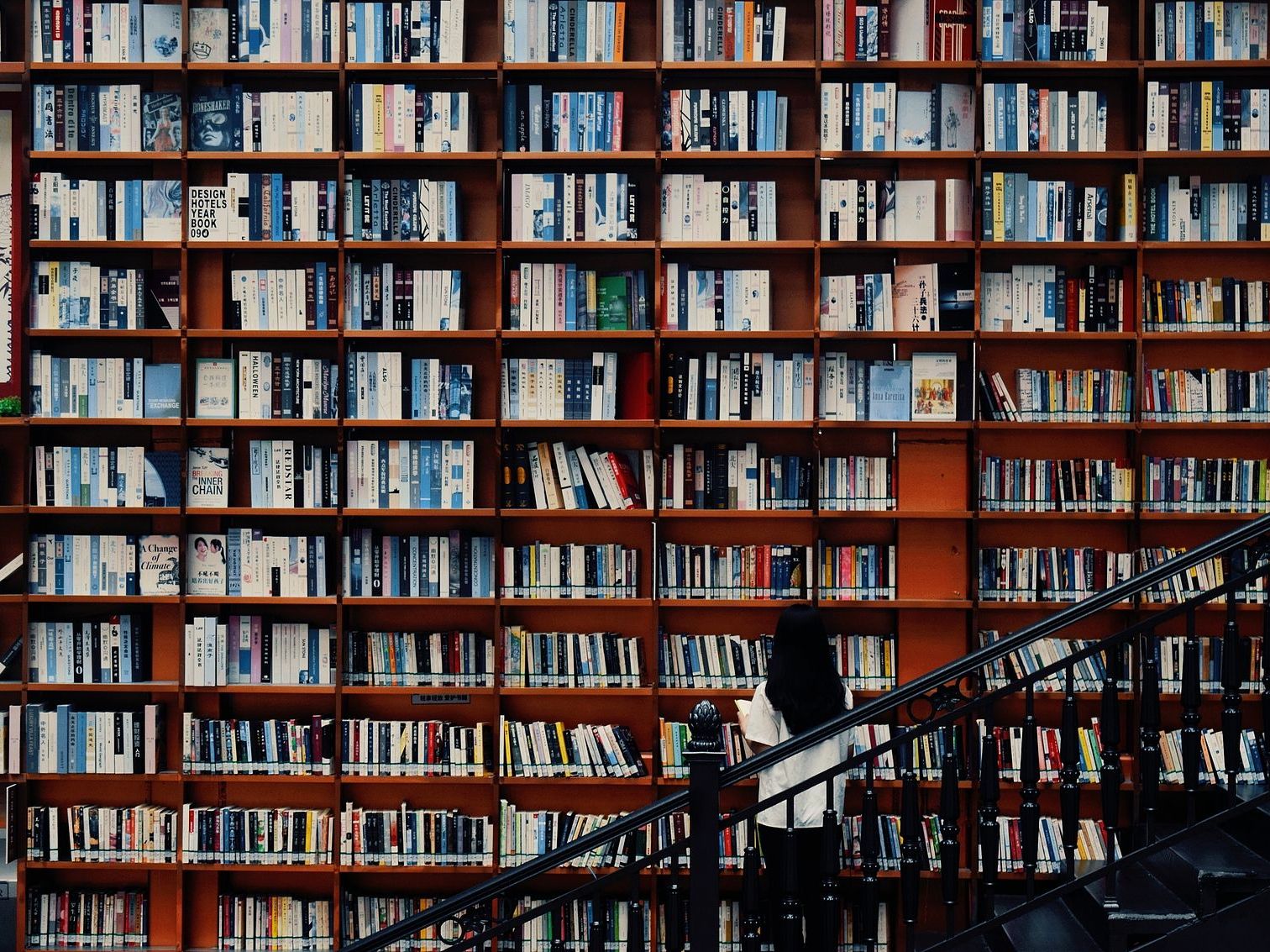 Chinese woman looking at books in bookstore, book influencer business china