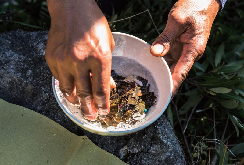 Soul plates are cleaned using high-percentage rich alcohol during the Bo funerals