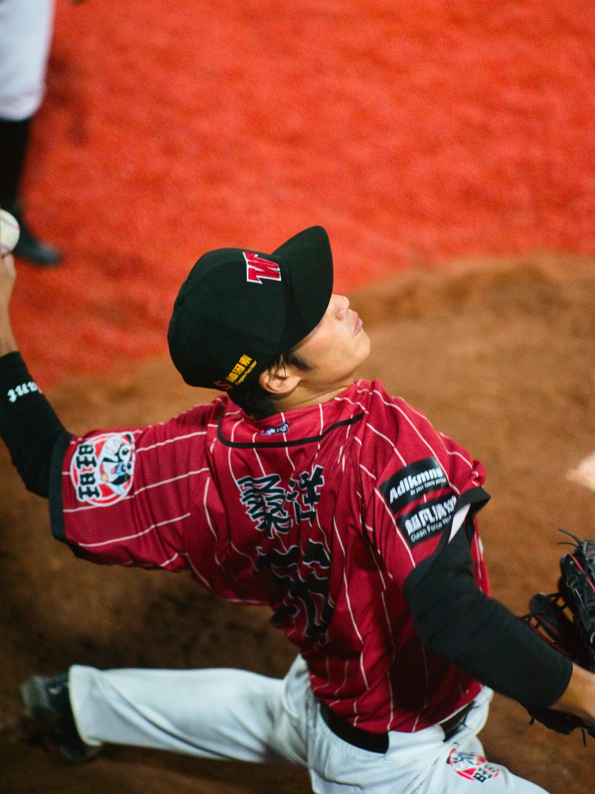 A pitcher for the Changsha Want Want practices in the bullpen