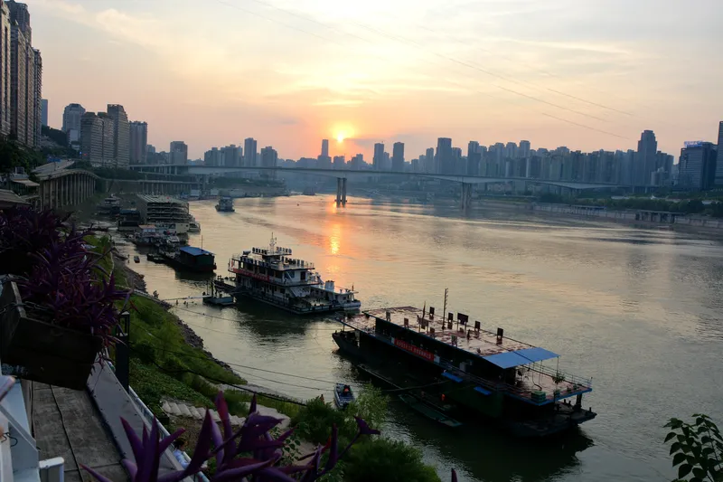 Bars across the road from Hongya Cave offer views of the river at sunset
