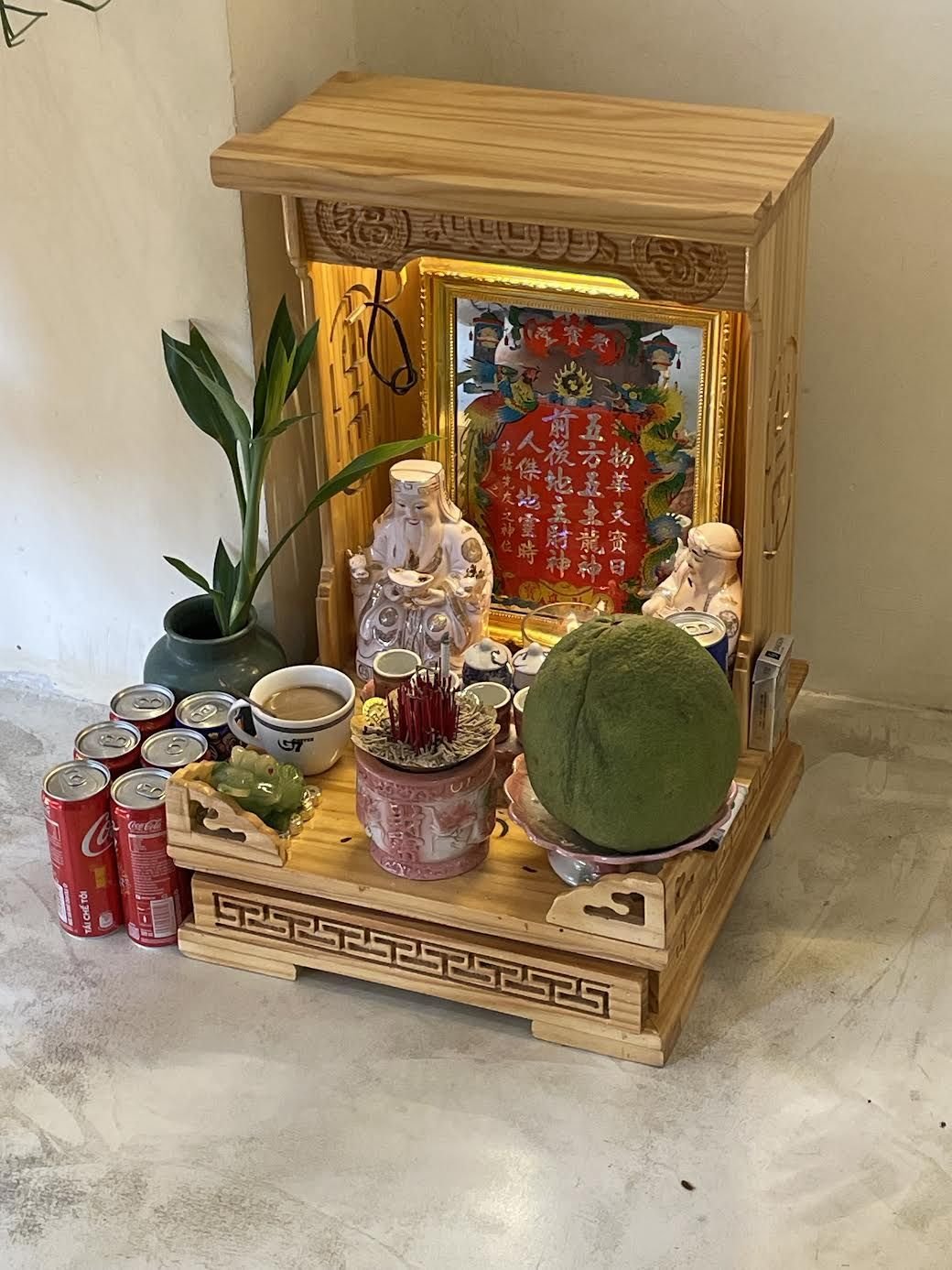 A small wooden altar for the deities of the land and wealth in Hanoi