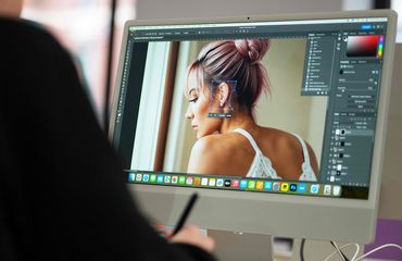 Designer editing an AI generated image
