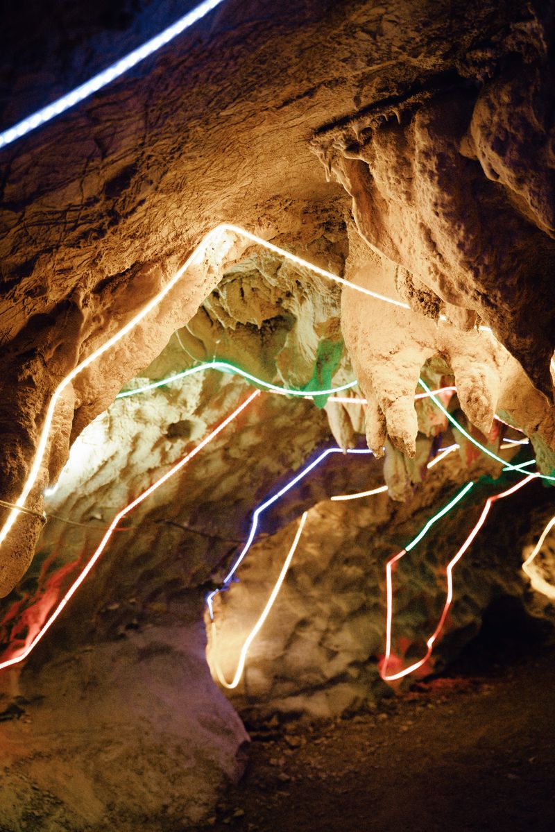 Locals put up colorful lights around the stalactites to decorate a cave in China