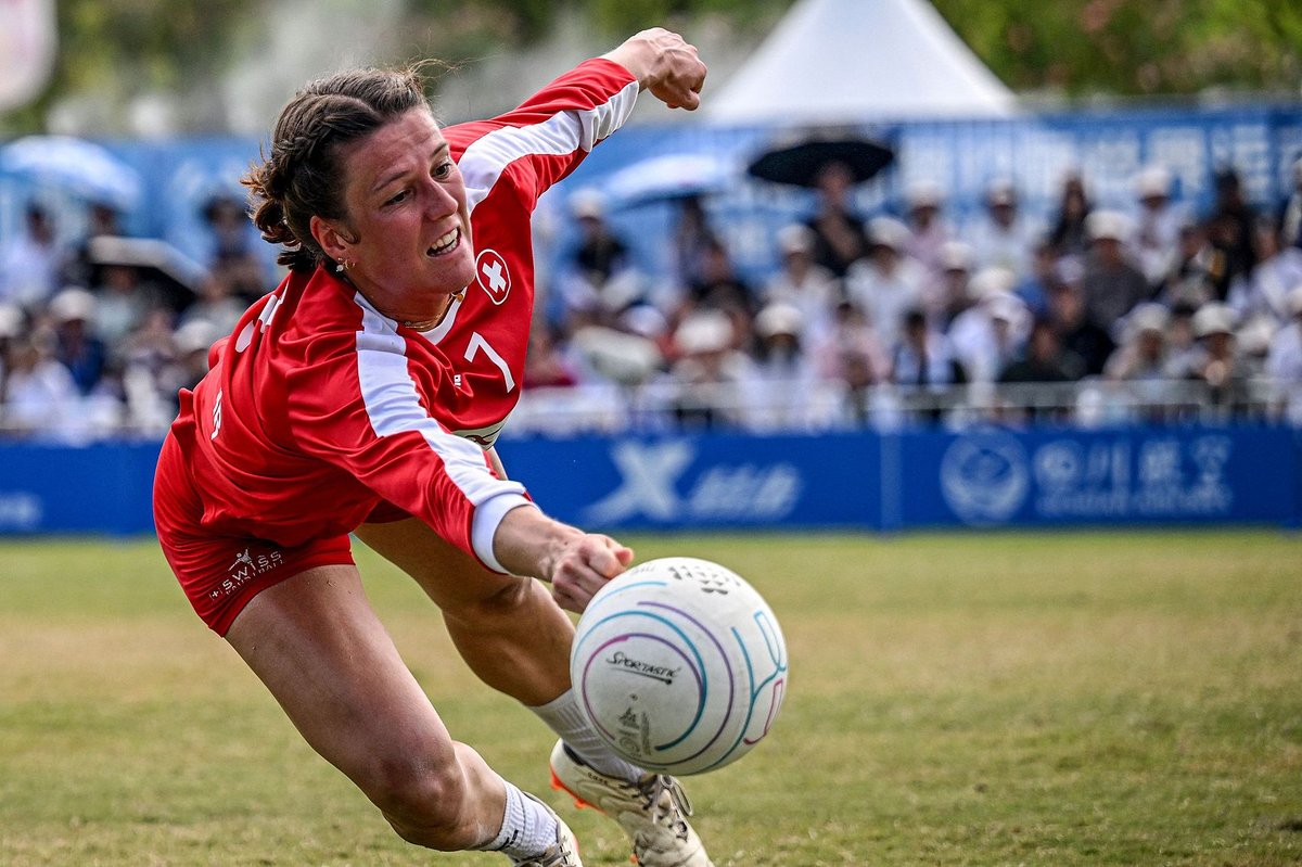 A member of the Swiss fistball team reaches for a ball in the finals between Switzerland and Brazil