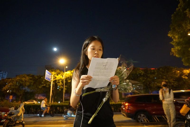 Xianzi reads a statement to her supporters and media after her court case ended