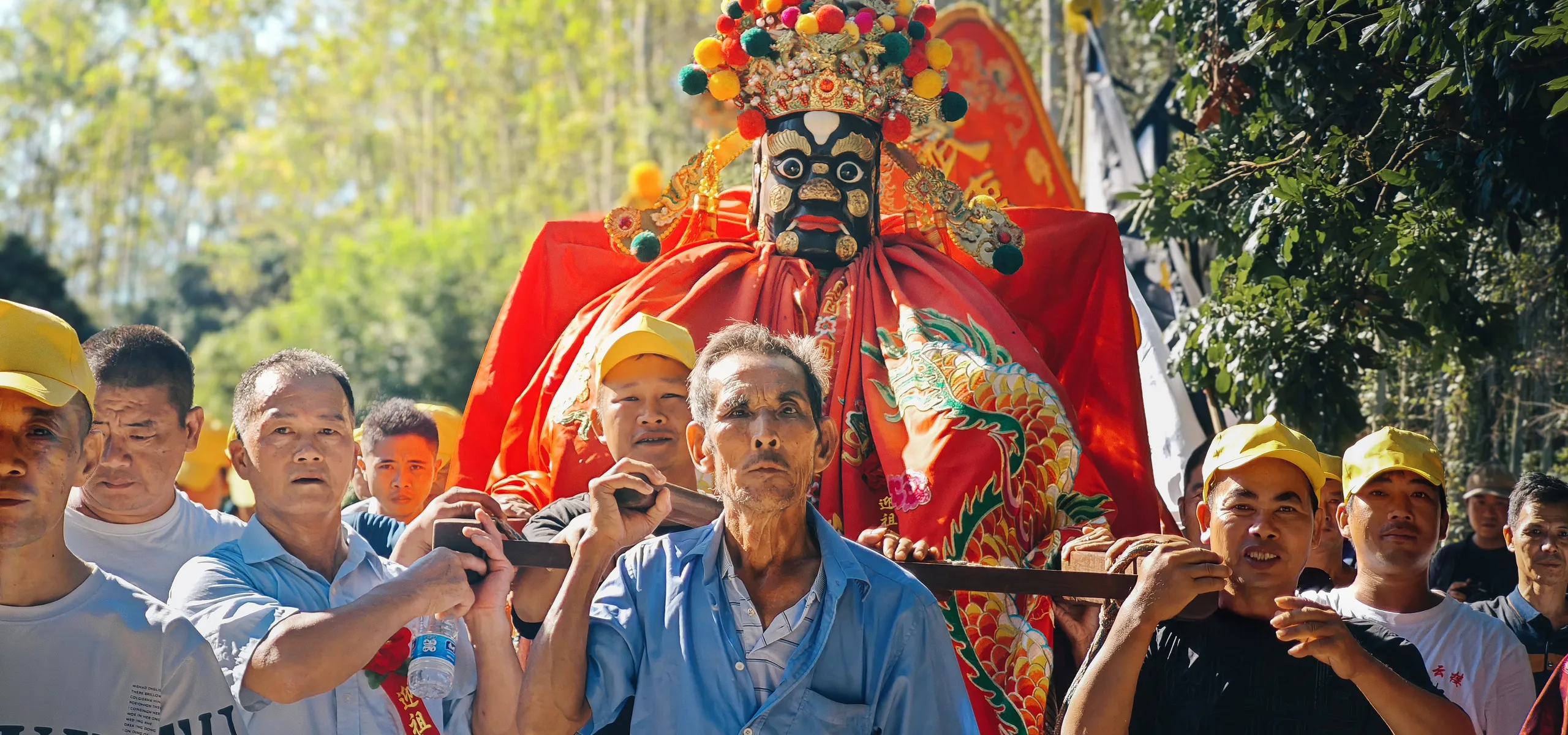 Villagers lifting ancestral lord