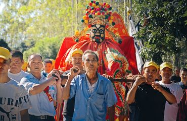 Villagers lifting ancestral lord