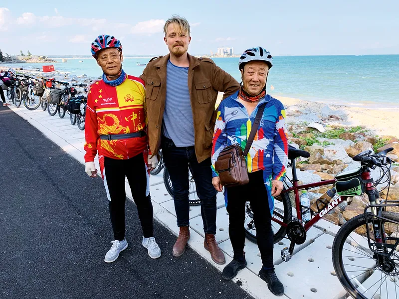 The author together with pensioners who are traversing the island on bicycles