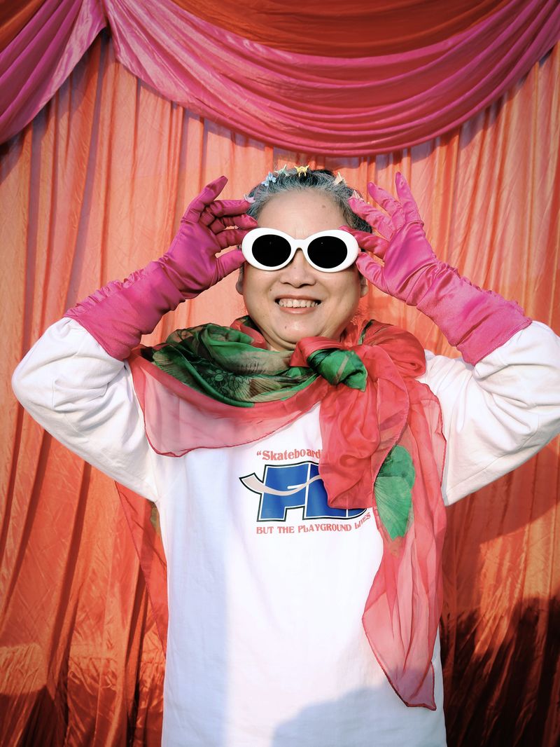 A resident at So Young’s Ya’an facility poses for a fashion photo shoot