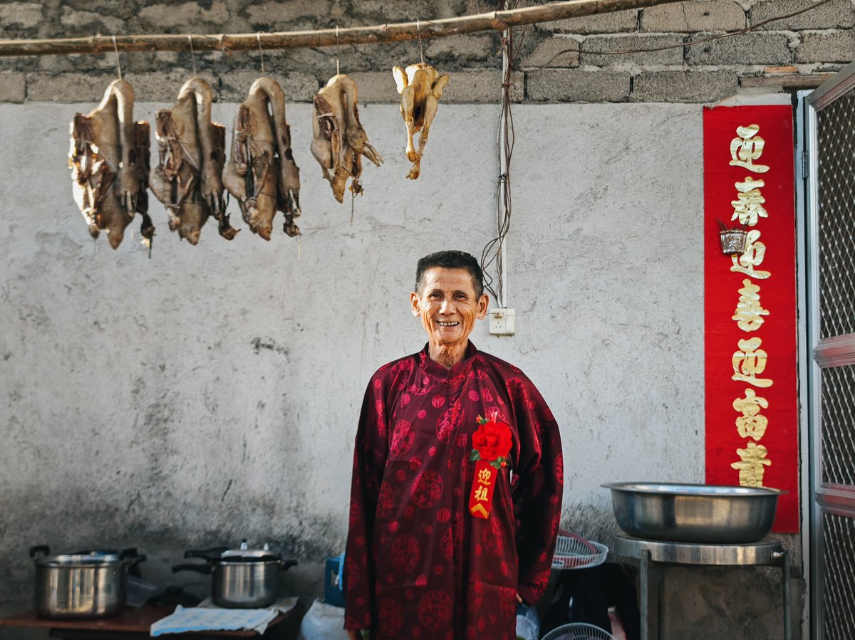Village elders in red robes