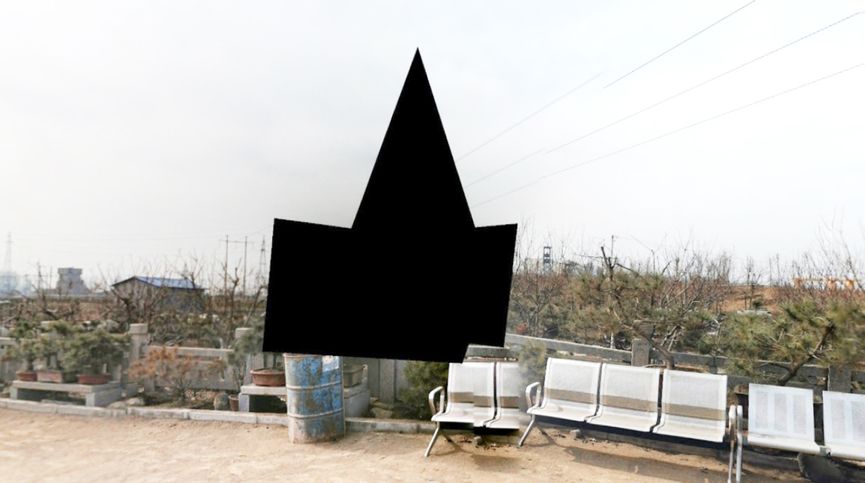 A close-up shot of a black triangle on a bench in Yan Jiacheng's "The Hollow of Google Street View"