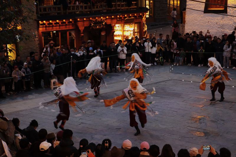 Locals perform folk opera and dance as part of the entertainment