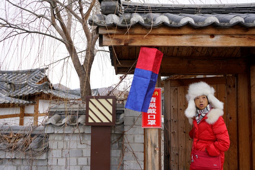 In March 2023, a sign asking visitors to wear a mask remains in a tourist attraction in Tumen, Jilin province (Siyi Chu)