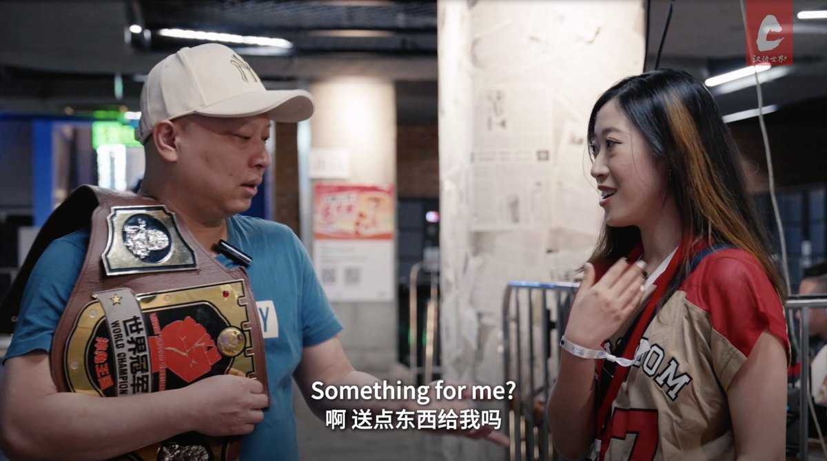 Pro wrestler Liu Xuanzheng, aka The Slam, holding his wrestling belt