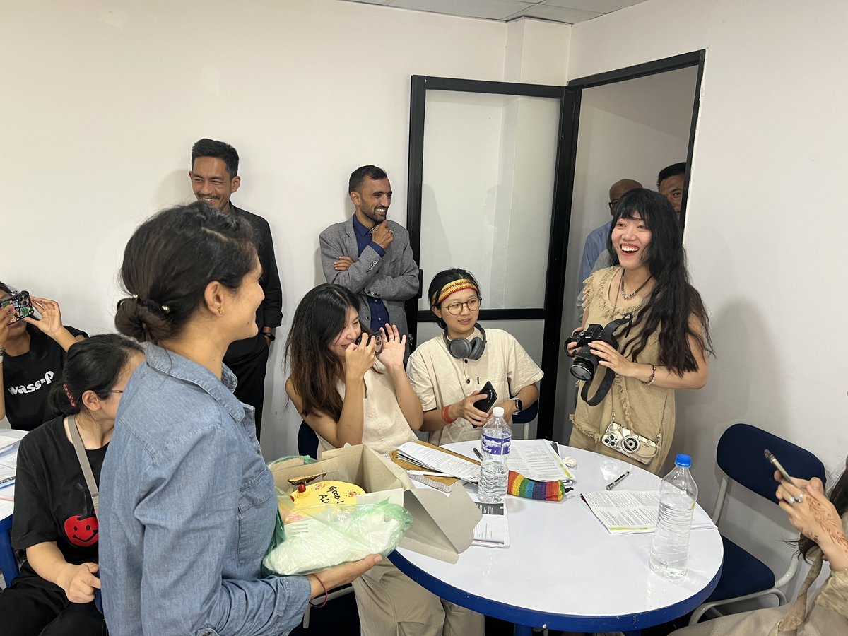 Ada Lu (right) receiving a surprise from her teachers at the language school upon completing all her coursework
