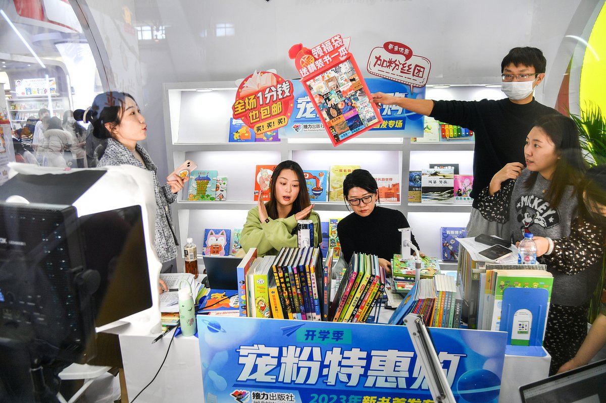 Livestreamers selling books at the 35th Beijing Book Fair in Beijing