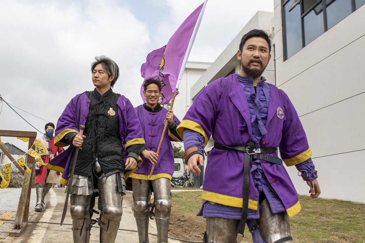 A Shanghai team marches into the arena in Chinese-style robes during the 2026 Comrade in Arms Cup