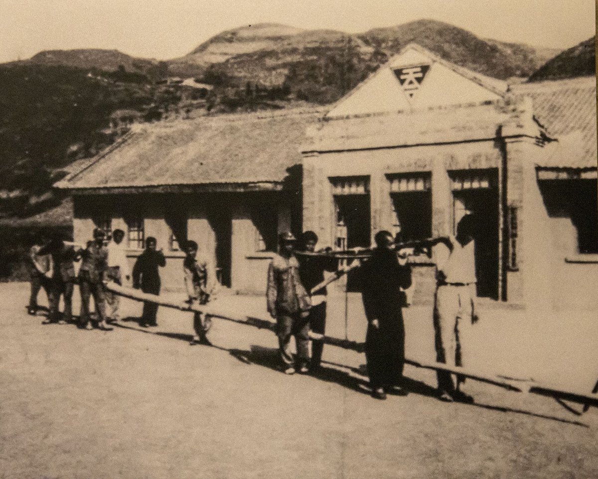 Members prepare to raise a flagpole in front of the northwest headquarters of the Chinese Industrial Cooperatives in 1941, Chinese origins of catchphrase gung ho