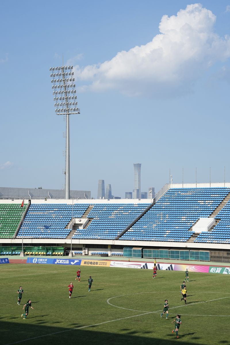 an empty soccer stadium for a women's super league match